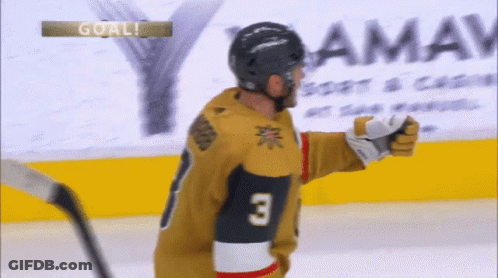 A Hockey Player Wearing A Jersey With The Number 3 GIF