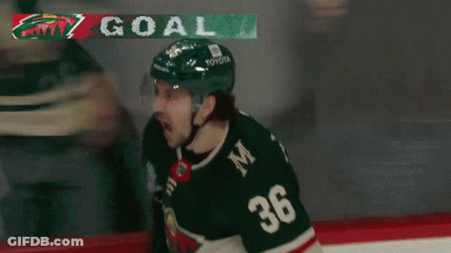 A Hockey Player Wearing A Jersey With The Number 36 On It GIF
