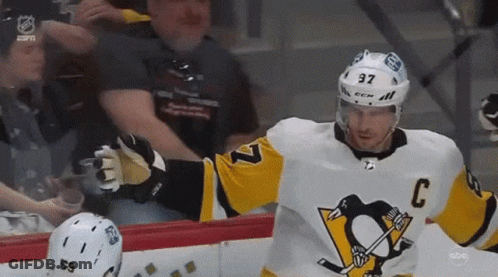 A Hockey Player Wearing A Jersey With The Number 37 On It GIF