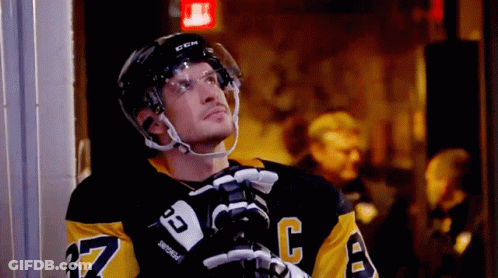 A Hockey Player Wearing A Jersey With The Number 37 On It GIF