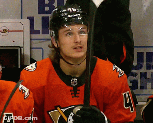 A Hockey Player Wearing A Jersey With The Number 4 GIF