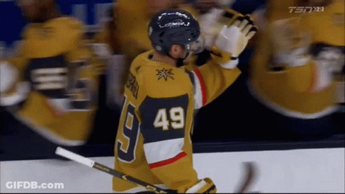 A Hockey Player Wearing A Jersey With The Number 49 On The Back GIF