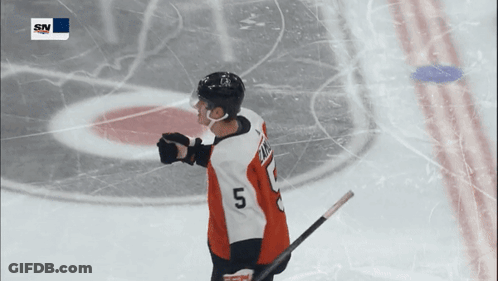 A Hockey Player Wearing A Jersey With The Number 5 On It GIF