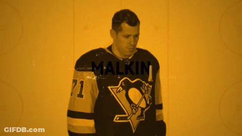 A Hockey Player Wearing A Jersey With The Number 71 GIF