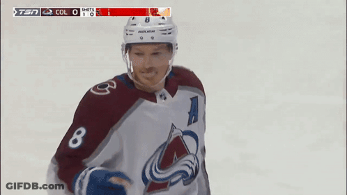 A Hockey Player Wearing A Jersey With The Number 8 GIF