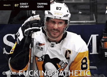 A Hockey Player Wearing A Jersey With The Number 8 On It GIF