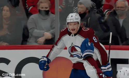A Hockey Player Wearing A Jersey With The Number 8 GIF