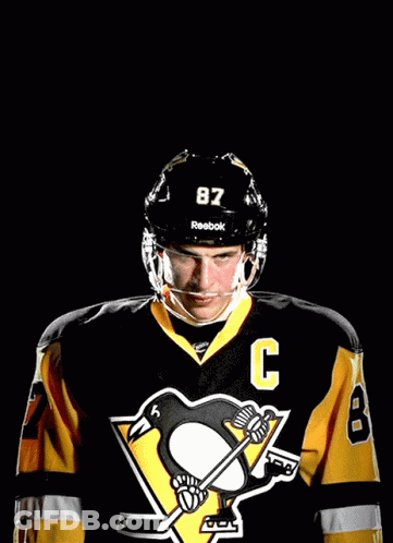 A Hockey Player Wearing A Jersey With The Number 87 On It GIF