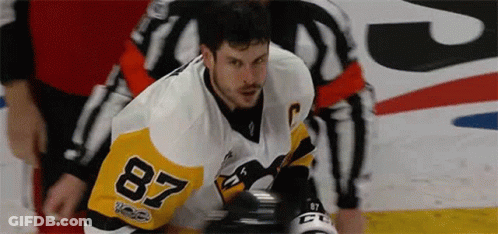 A Hockey Player Wearing A Jersey With The Number 87 On It GIF
