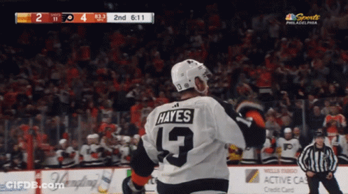 A Hockey Player Wearing A Jersey With The Number 9 On It GIF