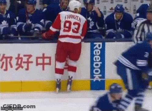 A Hockey Player Wearing A Jersey With The Number 93 On It GIF