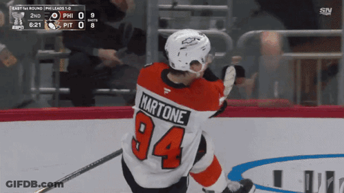 A Hockey Player Wearing A Jersey With The Number 94 GIF