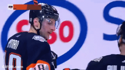 A Hockey Player Wearing A Number 10 Jersey GIF