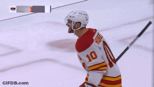 A Hockey Player Wearing A Number 10 Jersey GIF