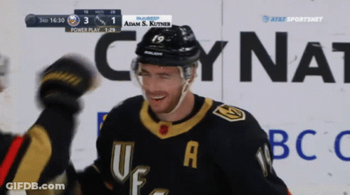 A Hockey Player Wearing A Number 19 Jersey Celebrates A Goal GIF
