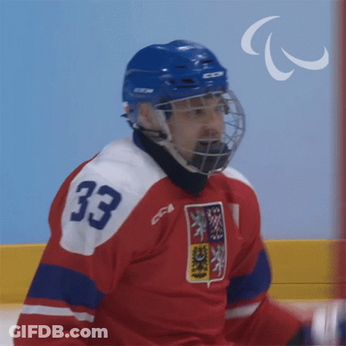 A Hockey Player Wearing A Number 33 Jersey GIF