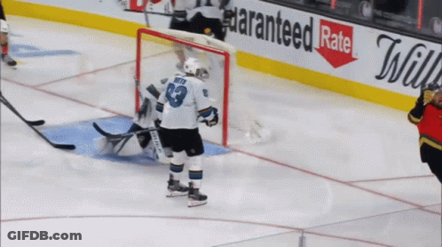A Hockey Player Wearing A Number 39 Jersey Stands On The Ice GIF