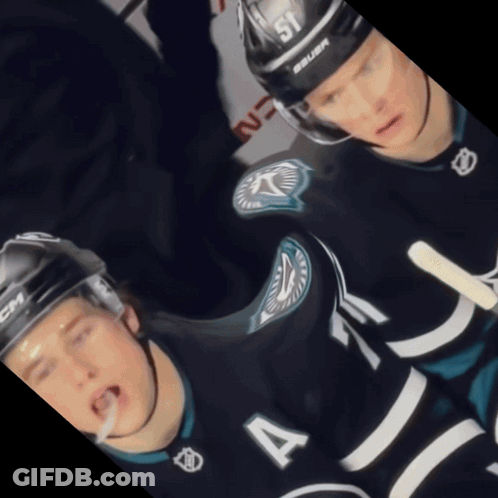A Hockey Player Wearing A Number 4 Jersey GIF