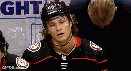 A Hockey Player Wearing A Number 46 Helmet GIF