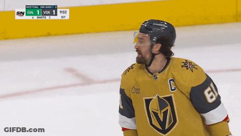 A Hockey Player Wearing A Number 6 Jersey Stands On The Ice GIF
