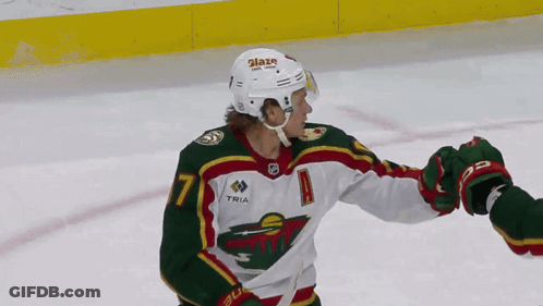 A Hockey Player Wearing A Number 7 Jersey GIF