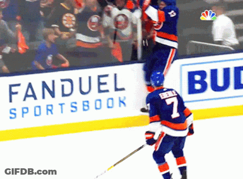 A Hockey Player Wearing A Number 7 Jersey Stands On The Ice GIF