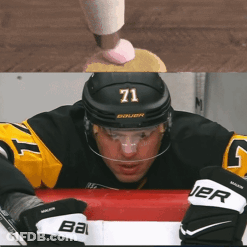A Hockey Player Wearing A Number 71 Jersey GIF