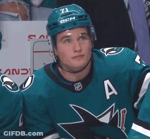A Hockey Player Wearing A Number 71 Jersey GIF