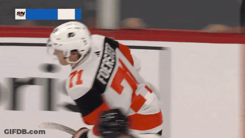 A Hockey Player Wearing A Number 71 Jersey GIF