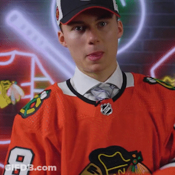 A Hockey Player Wearing A Number 8 Jersey GIF