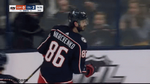 A Hockey Player Wearing A Number 86 Jersey GIF