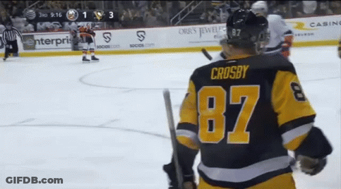 A Hockey Player Wearing A Number 87 Jersey Stands On The Ice GIF