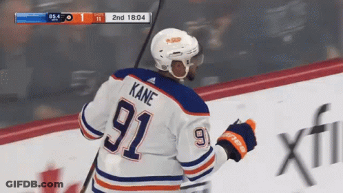 A Hockey Player Wearing A Number 92 Jersey GIF