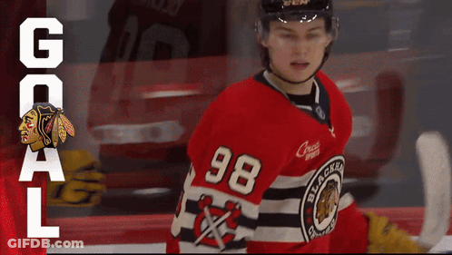 A Hockey Player Wearing A Number 98 Jersey GIF