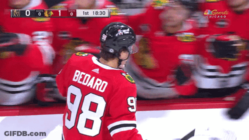 A Hockey Player Wearing A Number 98 Jersey GIF
