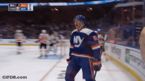 A Hockey Player Wearing A Ny Jersey Stands On The Ice GIF