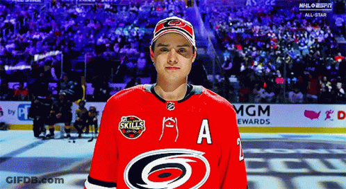 A Hockey Player Wearing A Red Jersey With The Letter A On The Front GIF