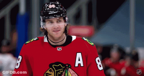 A Hockey Player Wearing A Red Jersey With The Letters B And A On It GIF