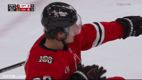 A Hockey Player Wearing A Red Jersey With The Letters Iog On It GIF