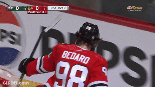 A Hockey Player Wearing A Red Jersey With The Name Bedard On It GIF
