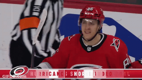 A Hockey Player Wearing A Red Jersey With The Number 26 On It GIF