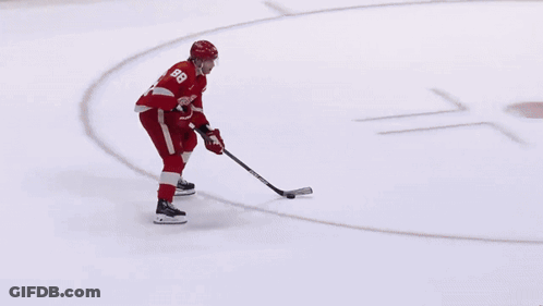 A Hockey Player Wearing A Red Jersey With The Number 8 On It GIF
