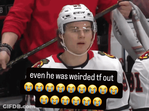 A Hockey Player Wearing A White Helmet With The Number 55 On It GIF