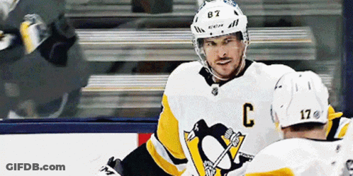 A Hockey Player Wearing A White Jersey With The Letter C On It GIF