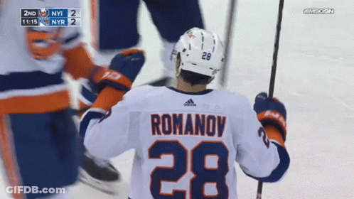 A Hockey Player Wearing A White Jersey With The Number 28 On It GIF
