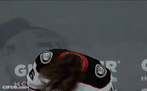 A Hockey Player Wearing A White Jersey With The Number 6 On It GIF