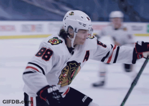 A Hockey Player Wearing A White Jersey With The Number 88 On It GIF