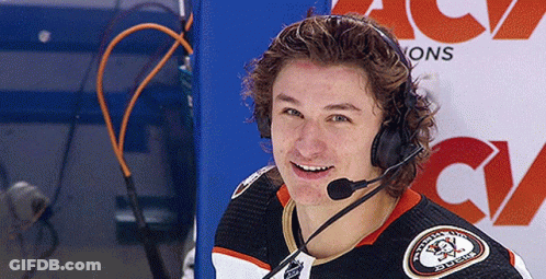 A Hockey Player Wearing Headphones And A Jersey That Says ' Washington Ducks ' On It GIF