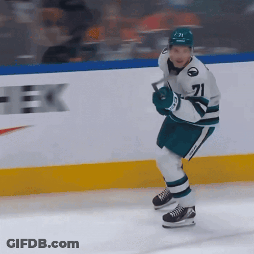 A Hockey Player Wearing Number 71 Is Holding A Hockey Stick GIF