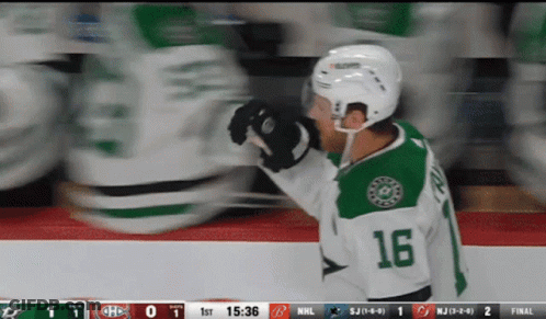 A Hockey Player Wearing The Number 16 Jersey GIF
